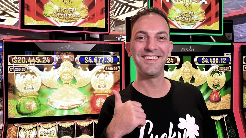 Brian Christopher in front of Big Fu Cash Bats with big bags
