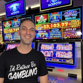 Brian Christopher in front of Wonder 4 Jackpots