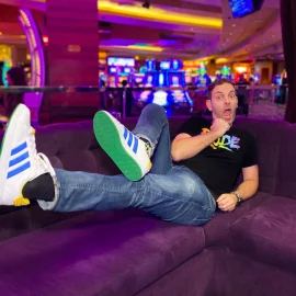 Brian sitting on a couch at the casino