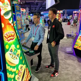 Brian and Marco browsing the Konami booth at G2E 2023