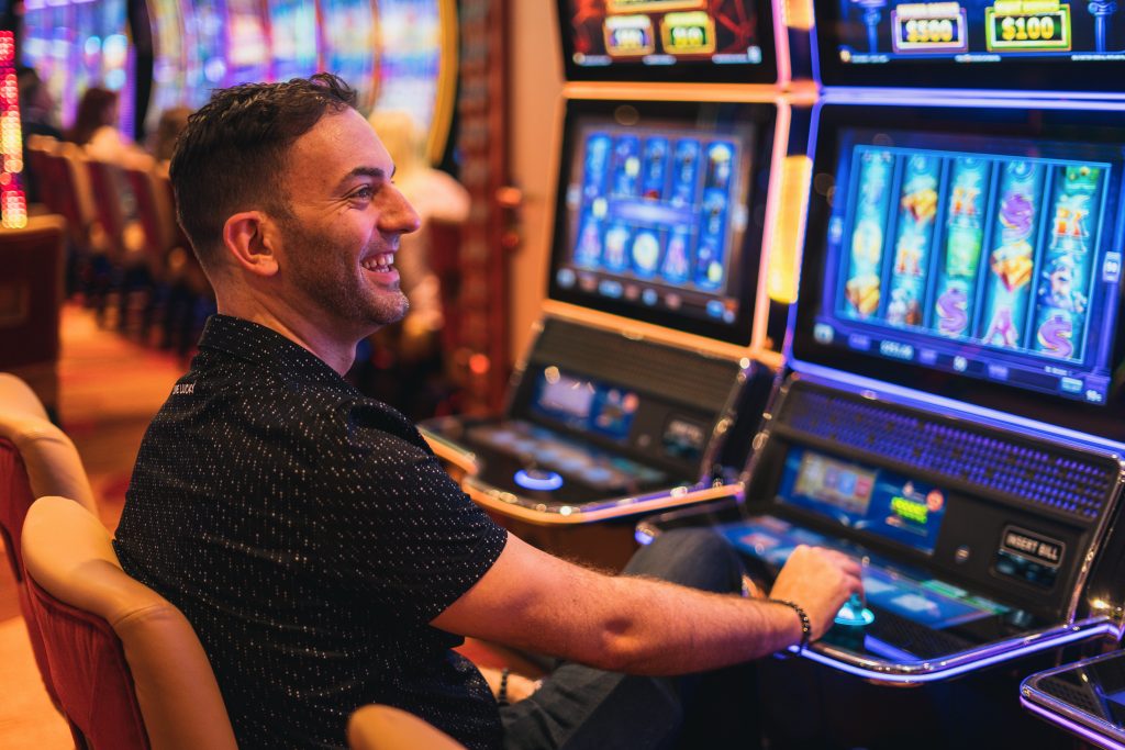 Brian Christopher playing a slot machine