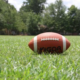 American football in the grass