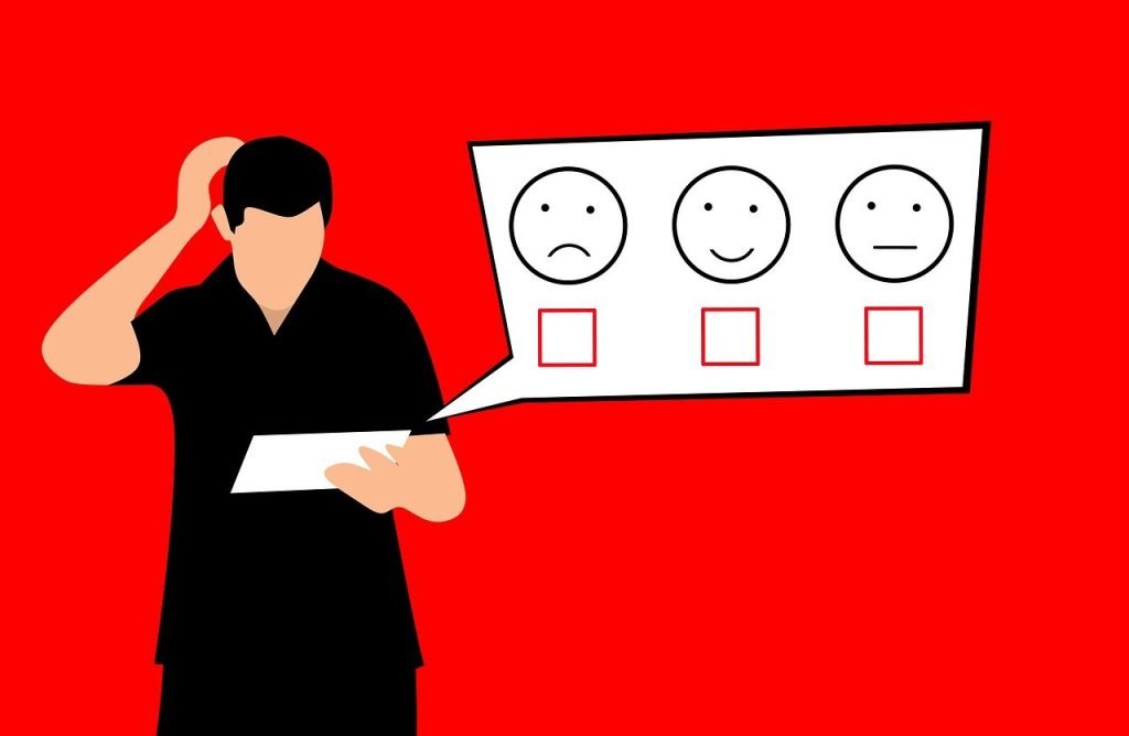 Person looking at smiley face ratings