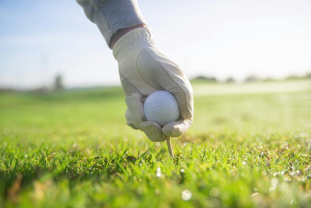 Golf ball being set on the ground