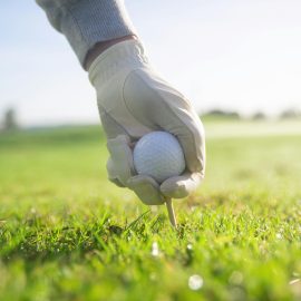 Golf ball being set on the ground