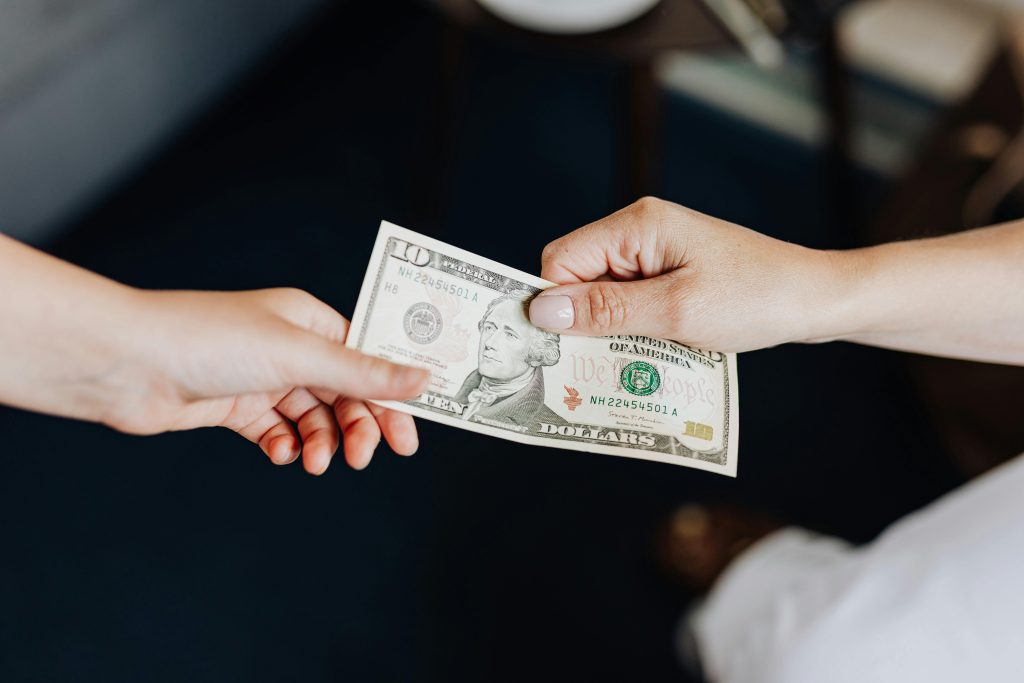 Handing over money to another hand