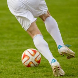 Soccer player kicking the ball
