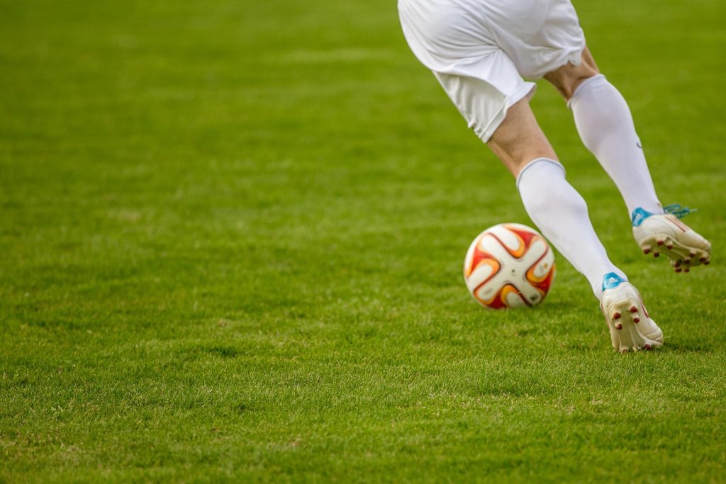 Soccer player kicking the ball