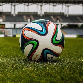 Soccer ball on field square