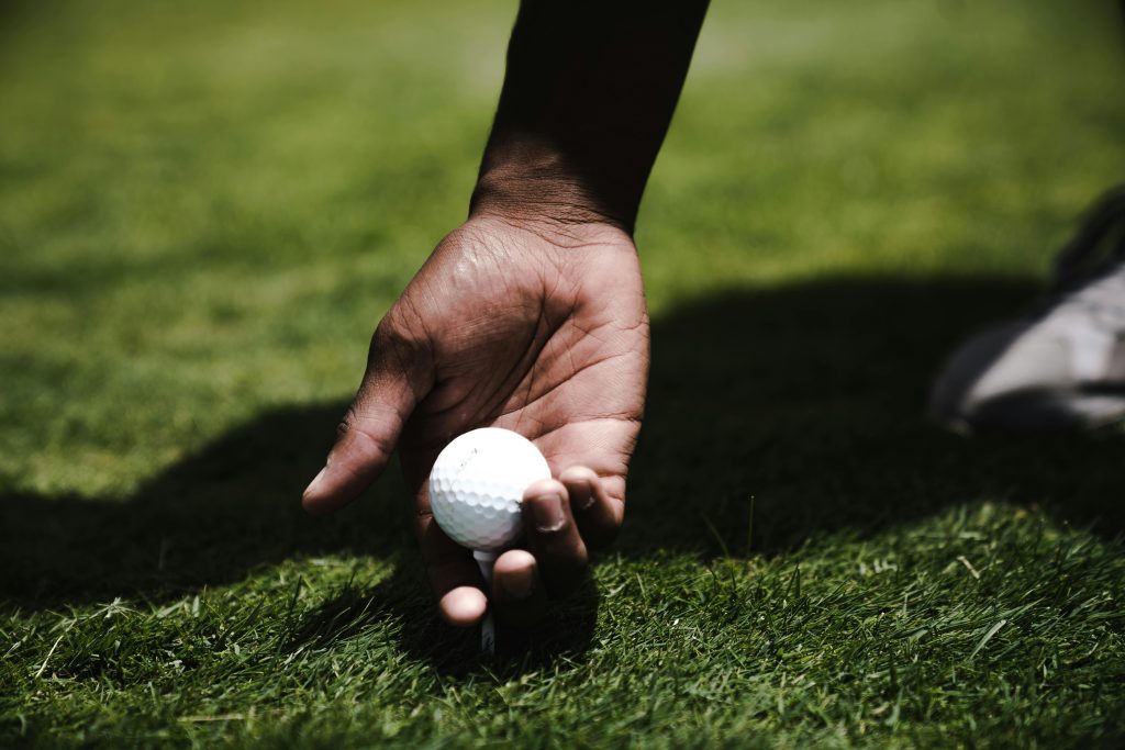 Person holding golf ball