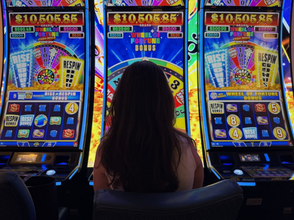 Person playing slot machine