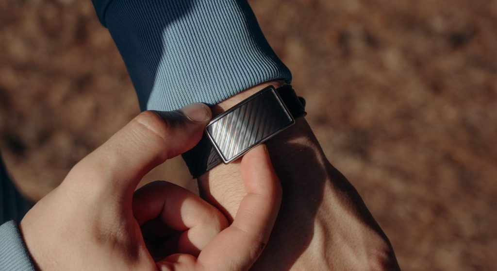 Person adjusting their arm band